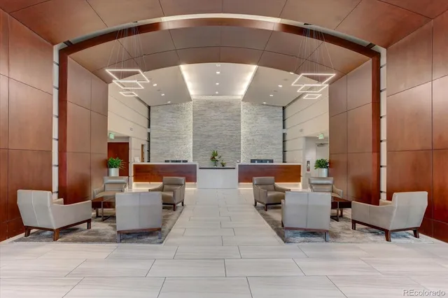 a view of a livingroom with furniture and a gym equipment