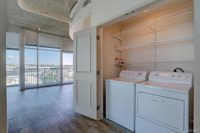 a view of storage and utility room with washer and dryer