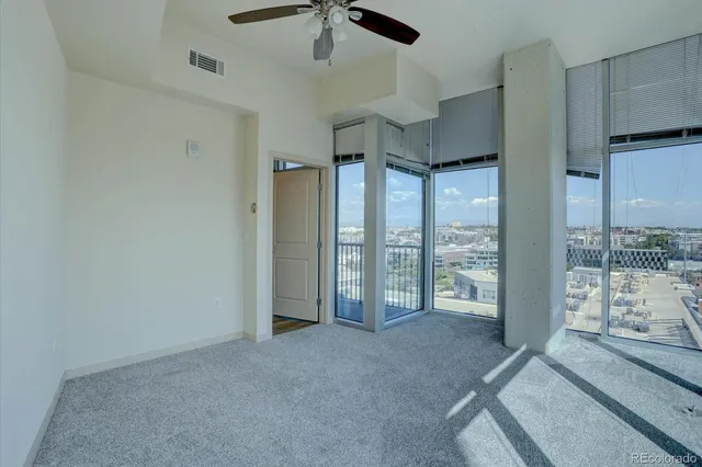 a view of an empty room with windows