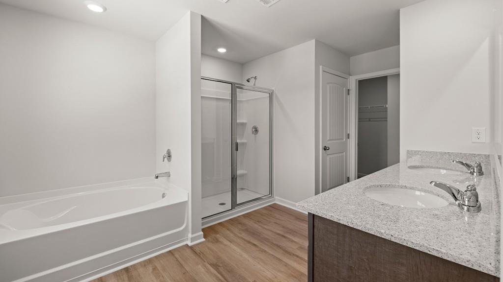 3245 Ryker Road, Unit 306 Gainesville, GA 30507 - Photo 11 of 35 a bathroom with a granite countertop sink and shower