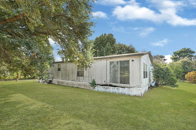 35494 Betka Road Hempstead, TX 77445 - Photo 12 of 37 a view of a house with backyard and garden
