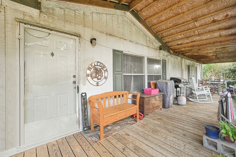 35494 Betka Road Hempstead, TX 77445 - Photo 16 of 37 a view of a dinning room and a wooden deck