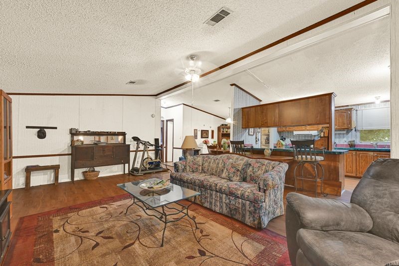 35494 Betka Road Hempstead, TX 77445 - Photo 19 of 37 a living room with furniture and a view of kitchen