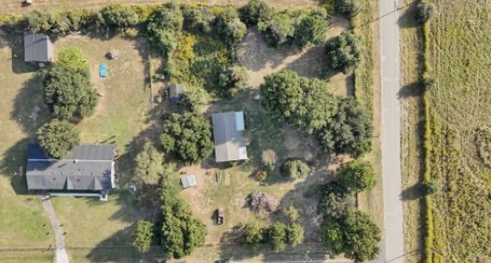 35494 Betka Road Hempstead, TX 77445 - Photo 2 of 7 an aerial view of a house with a yard and lake view