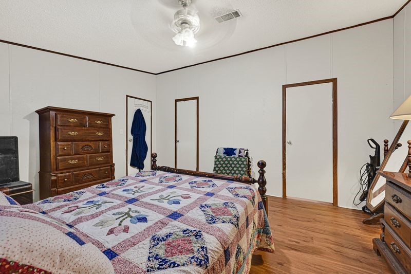 35494 Betka Road Hempstead, TX 77445 - Photo 25 of 37 a bedroom with a bed and a dresser