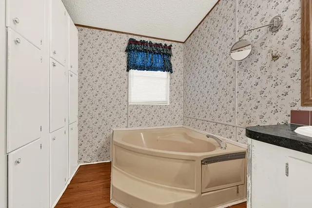 a bedroom with a bed a desk and chair