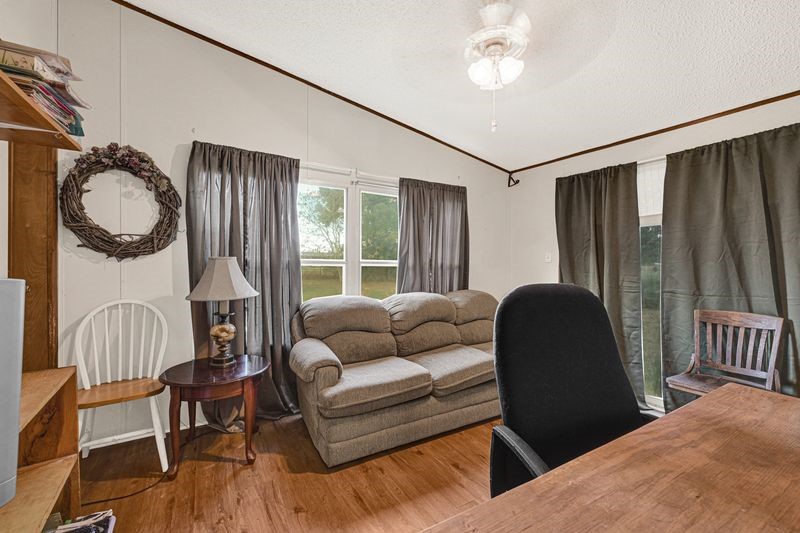 35494 Betka Road Hempstead, TX 77445 - Photo 31 of 37 a living room with furniture and a window