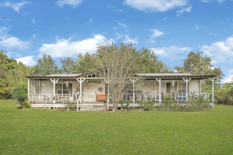 35494 Betka Road Hempstead, TX 77445 - Photo 8 of 37 a front view of house with yard and green space