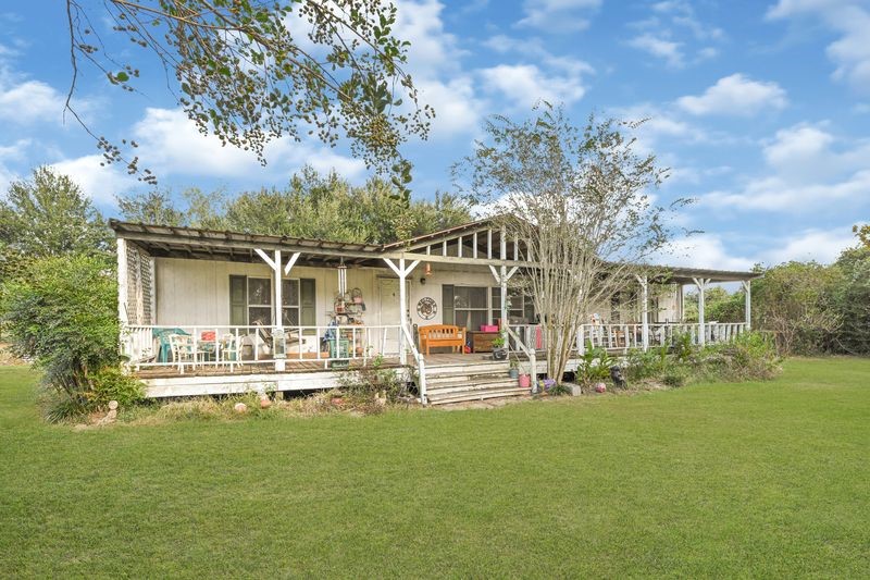 35494 Betka Road Hempstead, TX 77445 - Photo 9 of 37 front view of a house with a yard