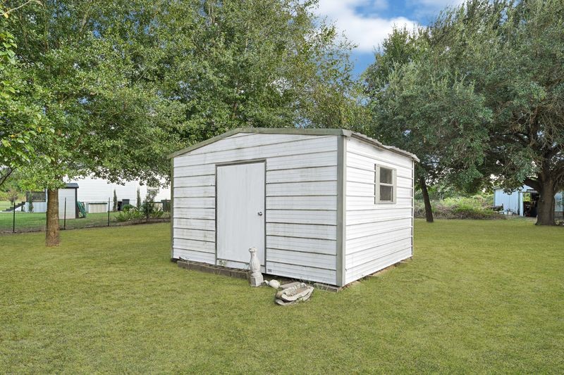 35494 Betka Road Hempstead, TX 77445 - Photo 10 of 37 a view of a house with a backyard