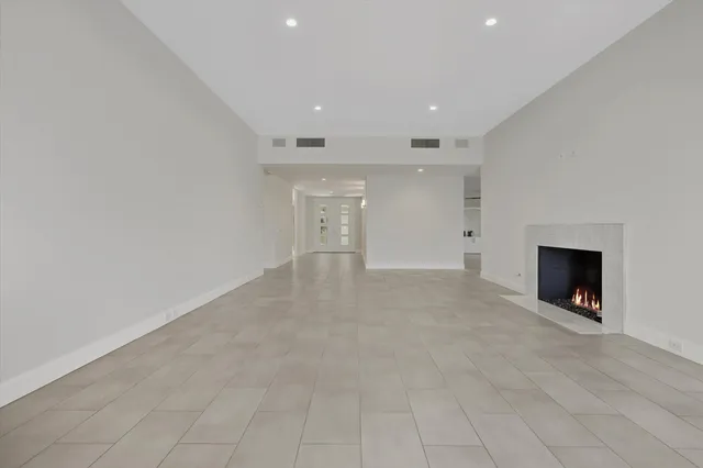 a view of an empty room with a fireplace