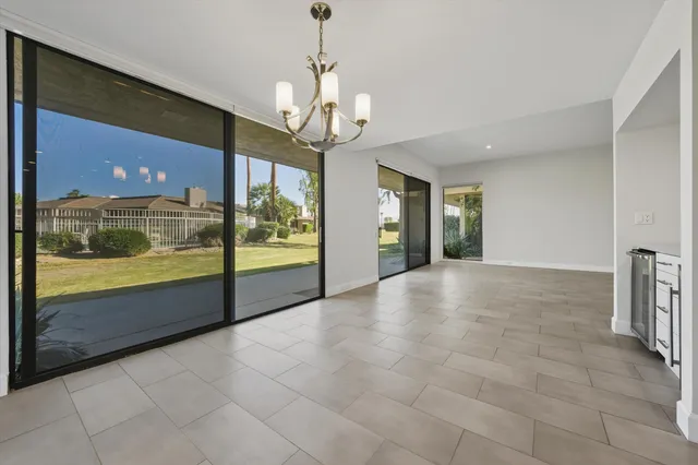 a view of an empty room with a balcony