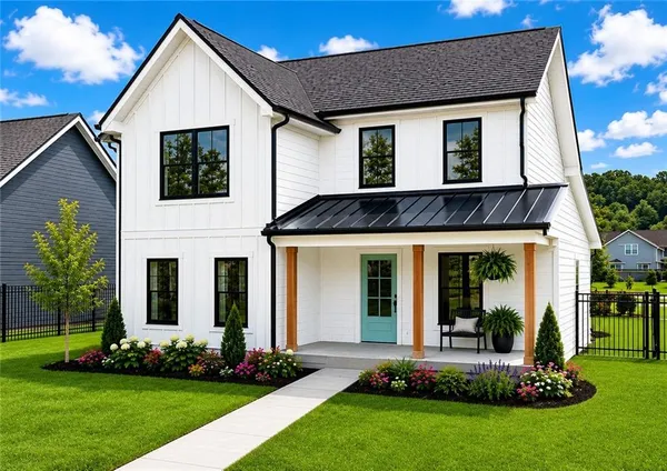 a front view of a house with a yard and porch