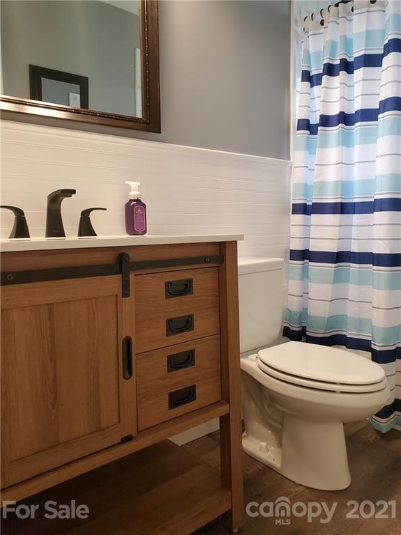 169 Porter Road Statesville, NC 28625 - Photo 14 of 26 a white toilet sitting next to a bathroom sink