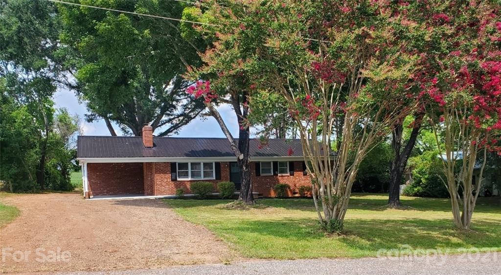 169 Porter Road Statesville, NC 28625 - Photo 3 of 26 a front view of a house with a yard and garage