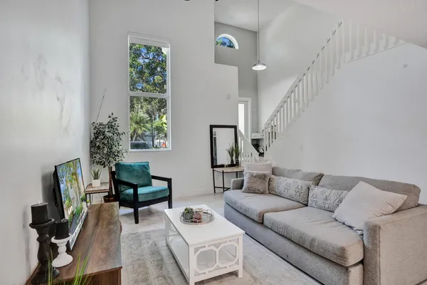a dining room with furniture and window