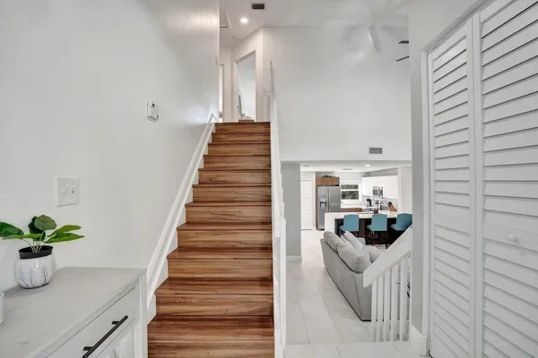 a bathroom with a sink toilet and mirror