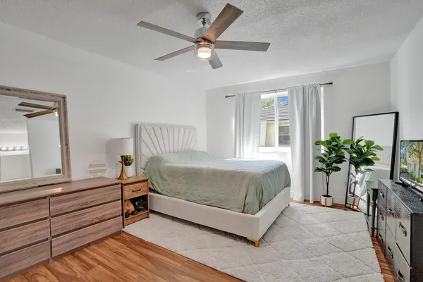 a bedroom with a bed and a bookshelf