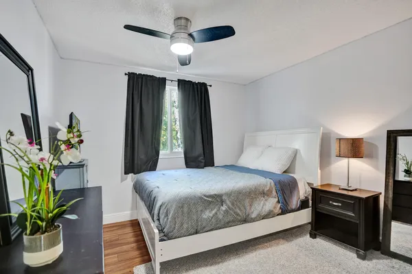 a view of room with wooden floor