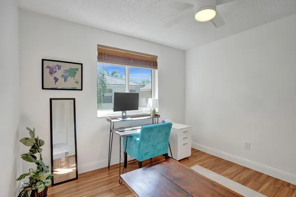 a bathroom with a sink mirror and toilet