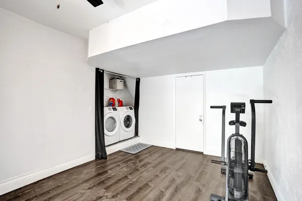 a view of house with backyard and outdoor seating