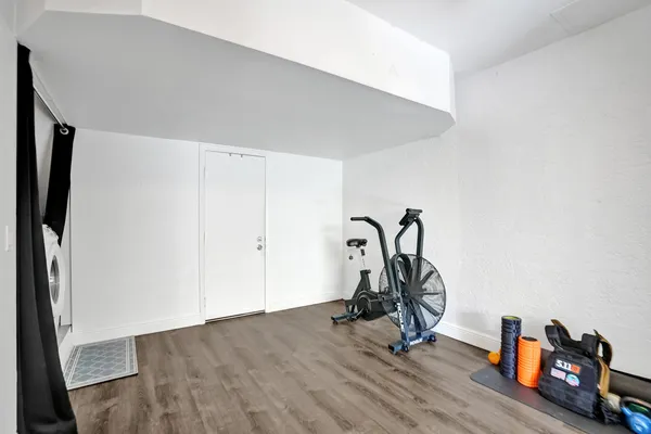 a view of a patio with table and chairs and potted plants