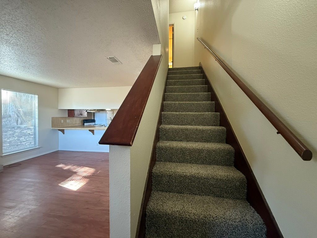 8102 Dunn Street, Unit A Austin, TX 78745 - Photo 12 of 21 a view of entryway and hall with wooden floor