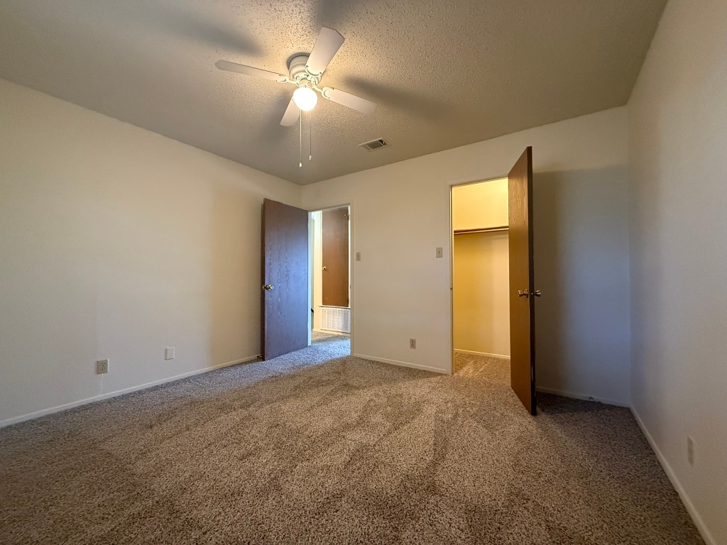 8102 Dunn Street, Unit A Austin, TX 78745 - Photo 15 of 21 a view of an empty room with a chandelier fan