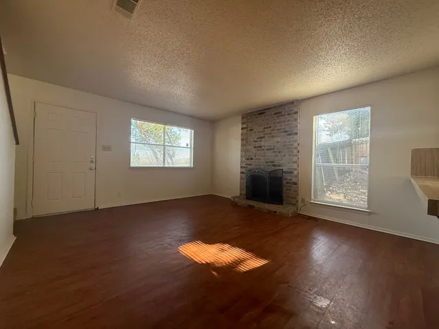 an empty room with windows