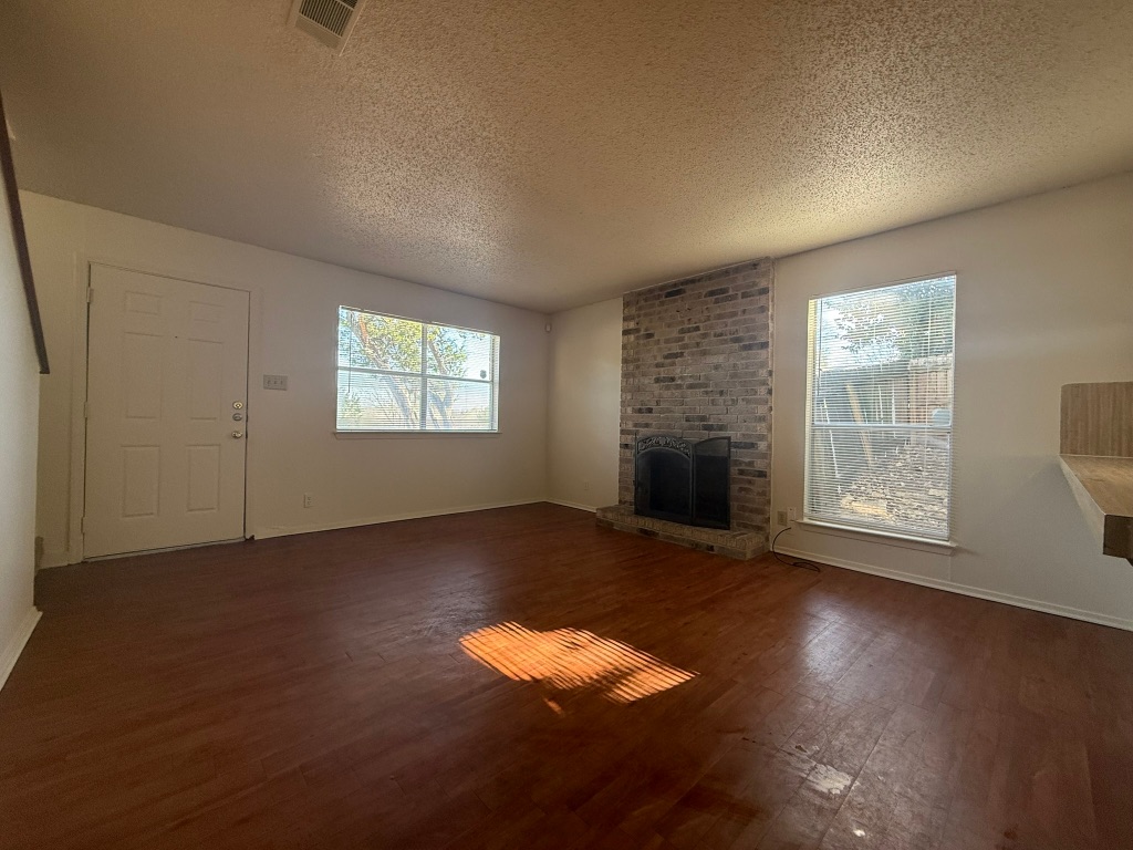 8102 Dunn Street, Unit A Austin, TX 78745 - Photo 4 of 21 an empty room with windows
