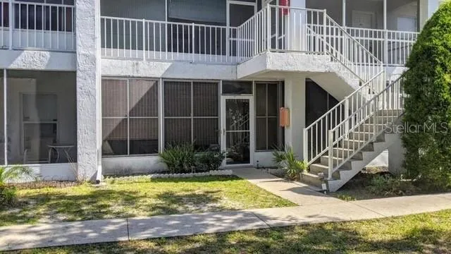 a view of a house with yard and plants