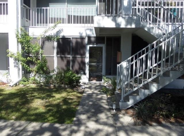 957 Southeast Mayo Drive, Unit 957 Crystal River, FL 34429 - Photo 18 of 22 a view of backyard with deck and outdoor seating