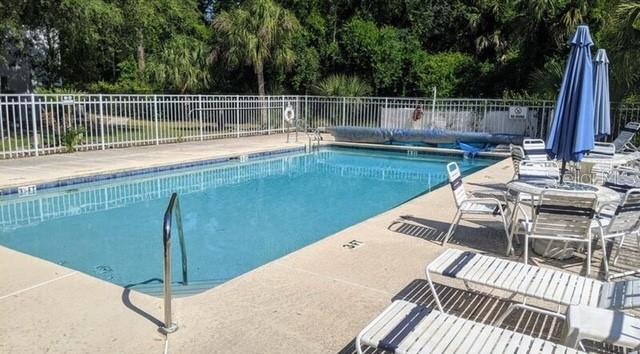 957 Southeast Mayo Drive, Unit 957 Crystal River, FL 34429 - Photo 22 of 22 a view of a wooden deck and a backyard