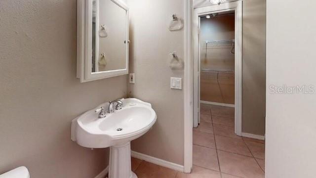 957 Southeast Mayo Drive, Unit 957 Crystal River, FL 34429 - Photo 5 of 22 a bathroom with a sink and a mirror