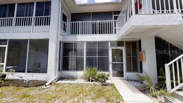 957 Southeast Mayo Drive, Unit 957 Crystal River, FL 34429 - Photo 7 of 22 a front view of a house with a yard