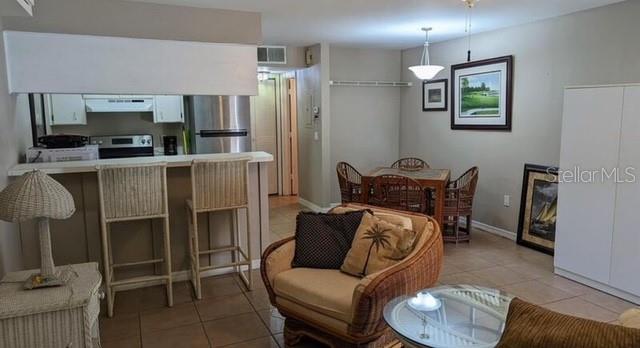 957 Southeast Mayo Drive, Unit 957 Crystal River, FL 34429 - Photo 10 of 22 a living room with furniture and a window