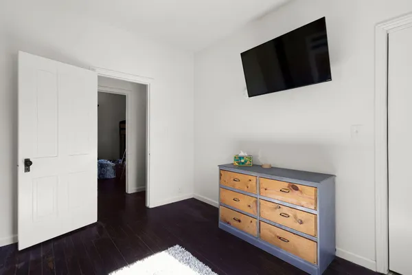 a room with furniture and wooden floor