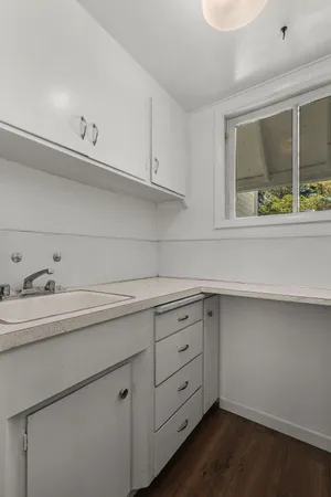 a utility room with cabinets