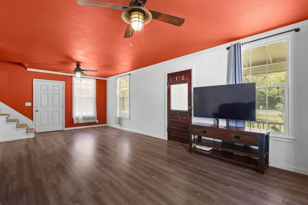 a living room with furniture and a flat screen tv