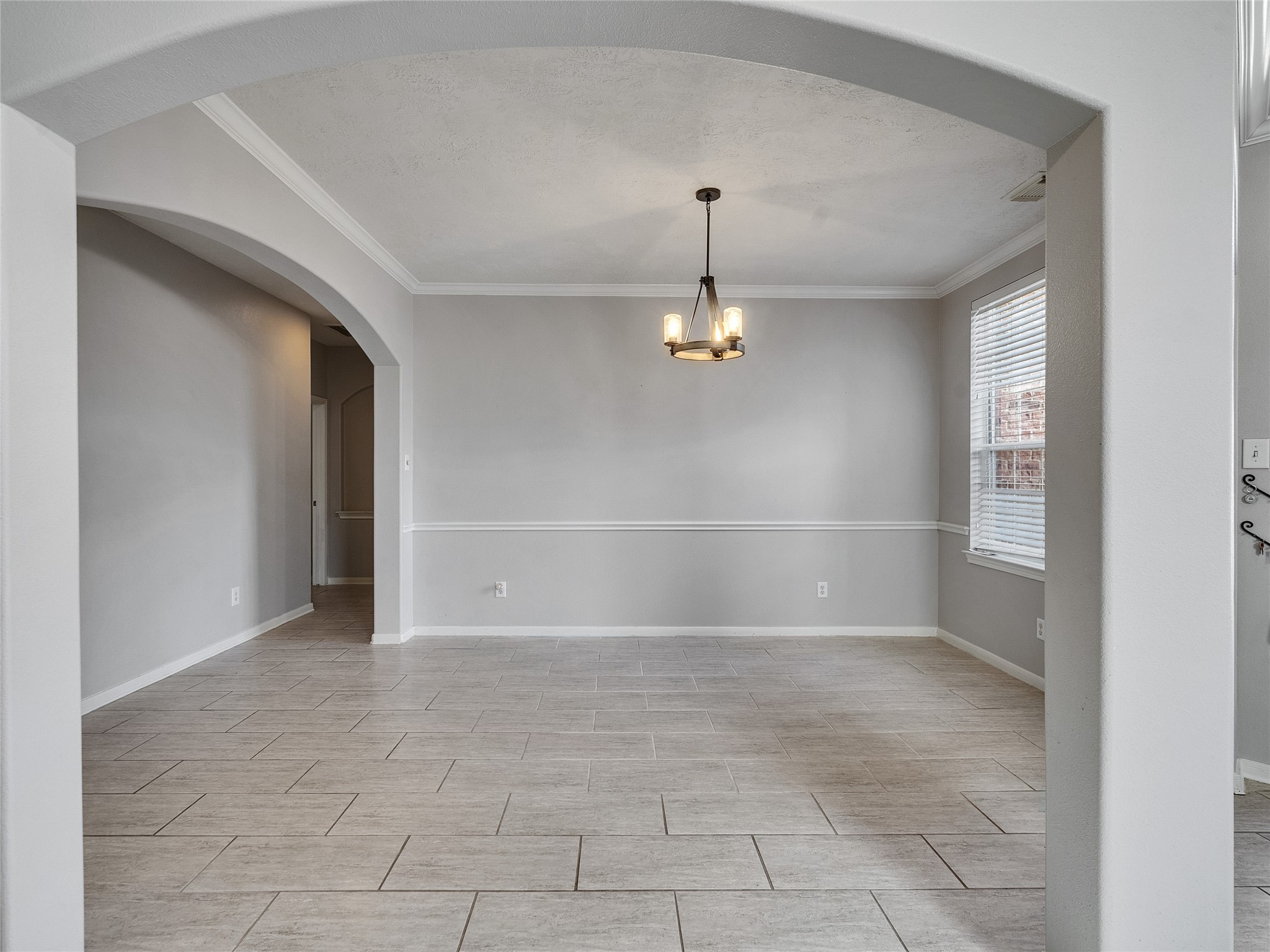 2615 Fern Lacy Drive Spring, TX 77388 - Photo 3 of 32 This huge formal dining room was made for those family gatherings with enough space to invite some neighbors and friends and be able to accommodate them. There's plenty of natural light to help illuminate the area as well.