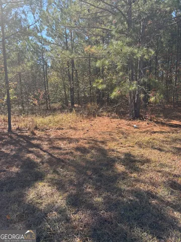 a view of empty room with trees