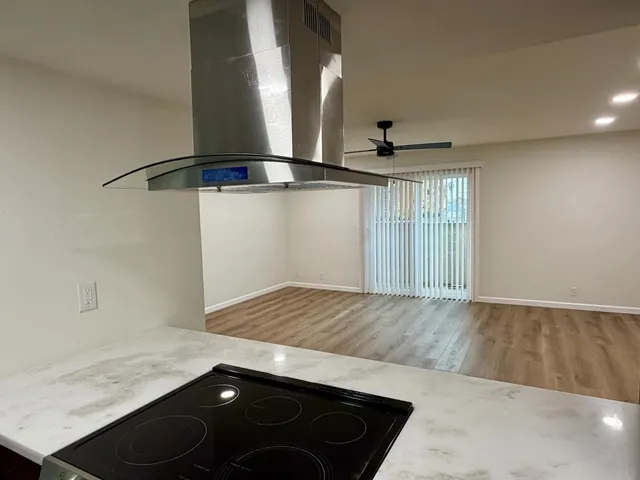 a view of a room with wooden floor