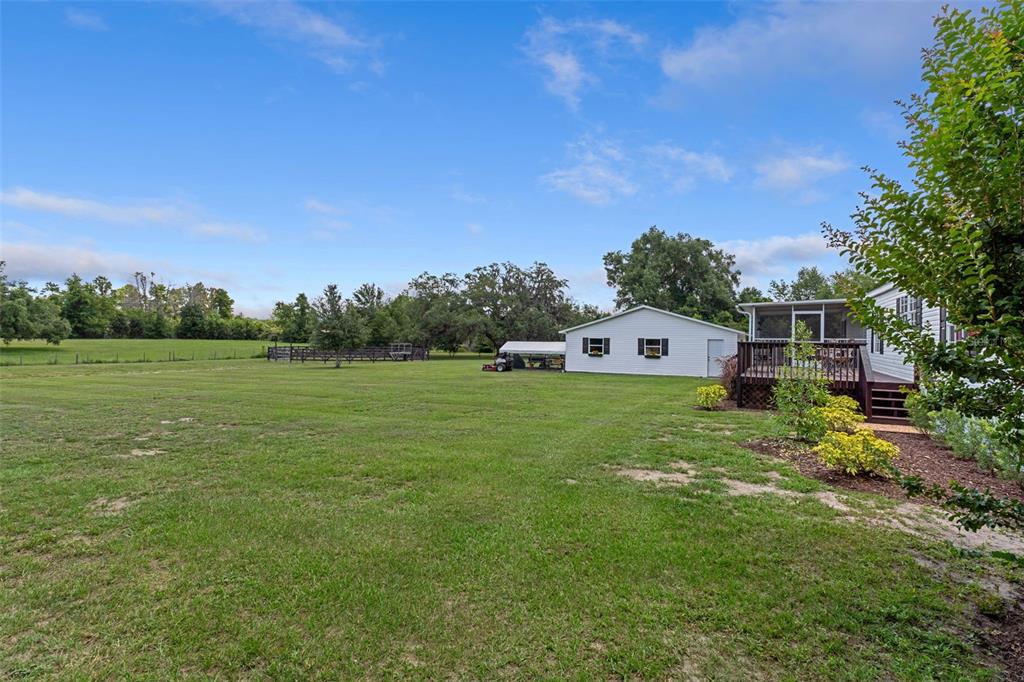 26255 Lambeth Road Brooksville, FL 34601 - Photo 57 of 76 a view of a house with a big yard