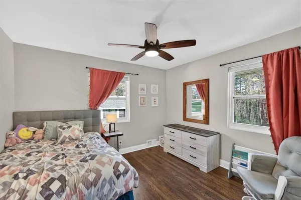 a bedroom with a bed and window