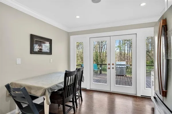 a view of a dining room with furniture and wooden floor