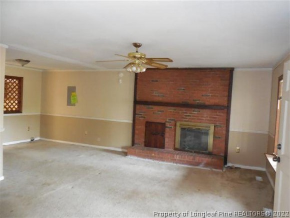 2474 Docs Road Lillington, NC 27546 - Photo 3 of 14 an empty room with windows and fireplace