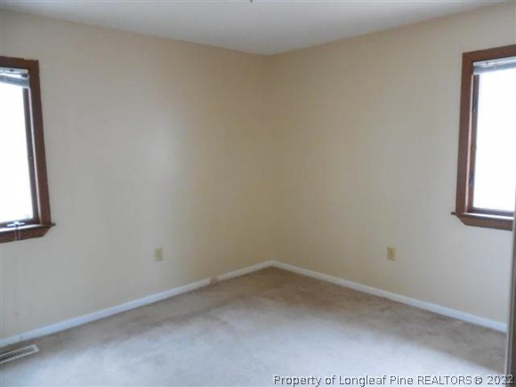 2474 Docs Road Lillington, NC 27546 - Photo 8 of 14 an empty room with a window
