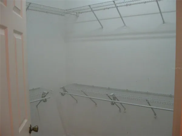 a view of a room with racks on the wall
