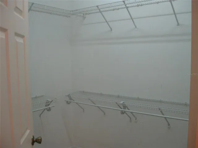 a view of a room with racks on the wall