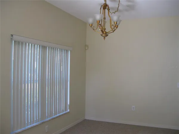 a view of a hallway with a chandelier